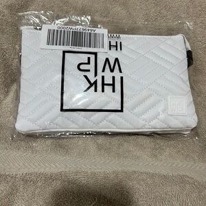 White cross body bag with zipper entry, can be cross body or wristlet.